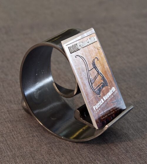 A metal ring holding a business card.