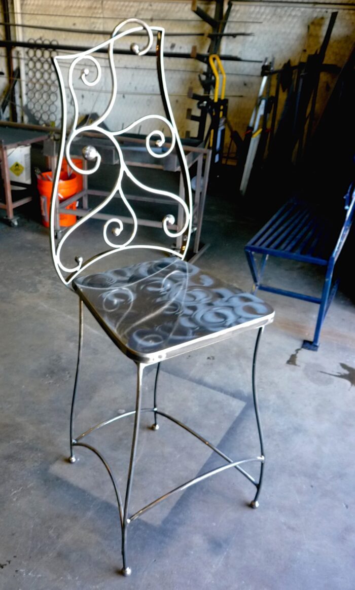 A chair with some graffiti on it