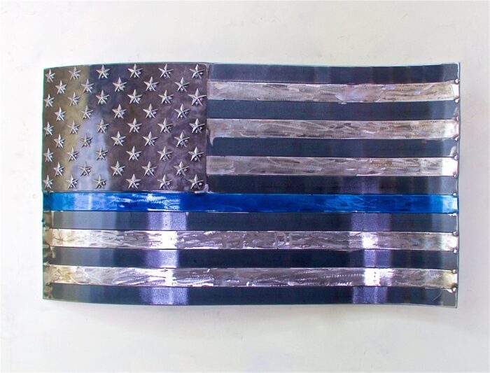 A thin blue line flag is painted on the wall.