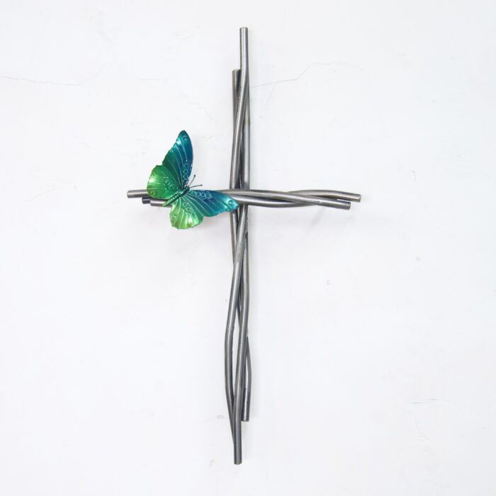 A cross with a bird on it is shown.