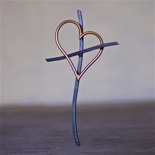 A cross with a heart on it.