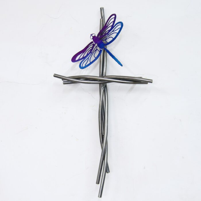 A cross with a purple and blue dragonfly on it.