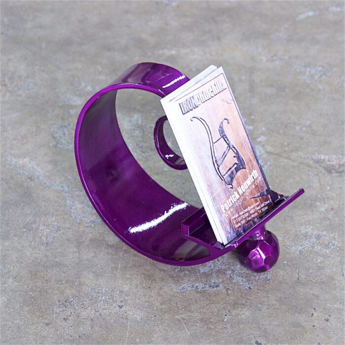 A purple bracelet with a phone on it