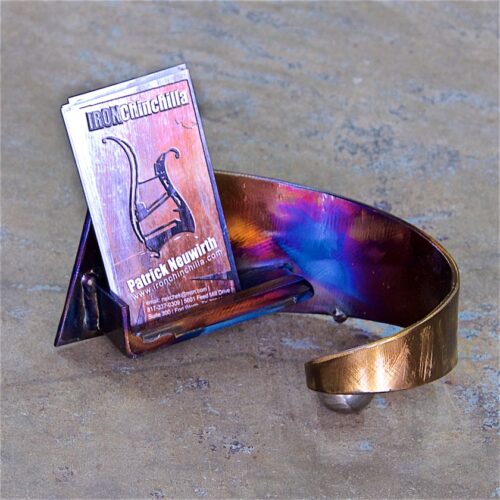 A metal bracelet with a small box of music.