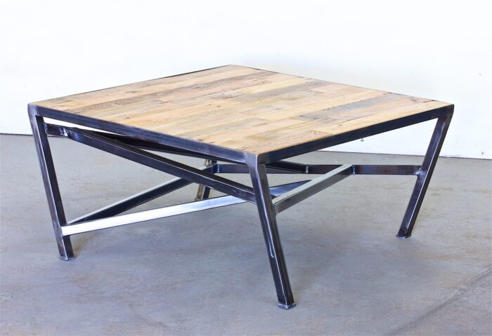 A square coffee table with two metal legs